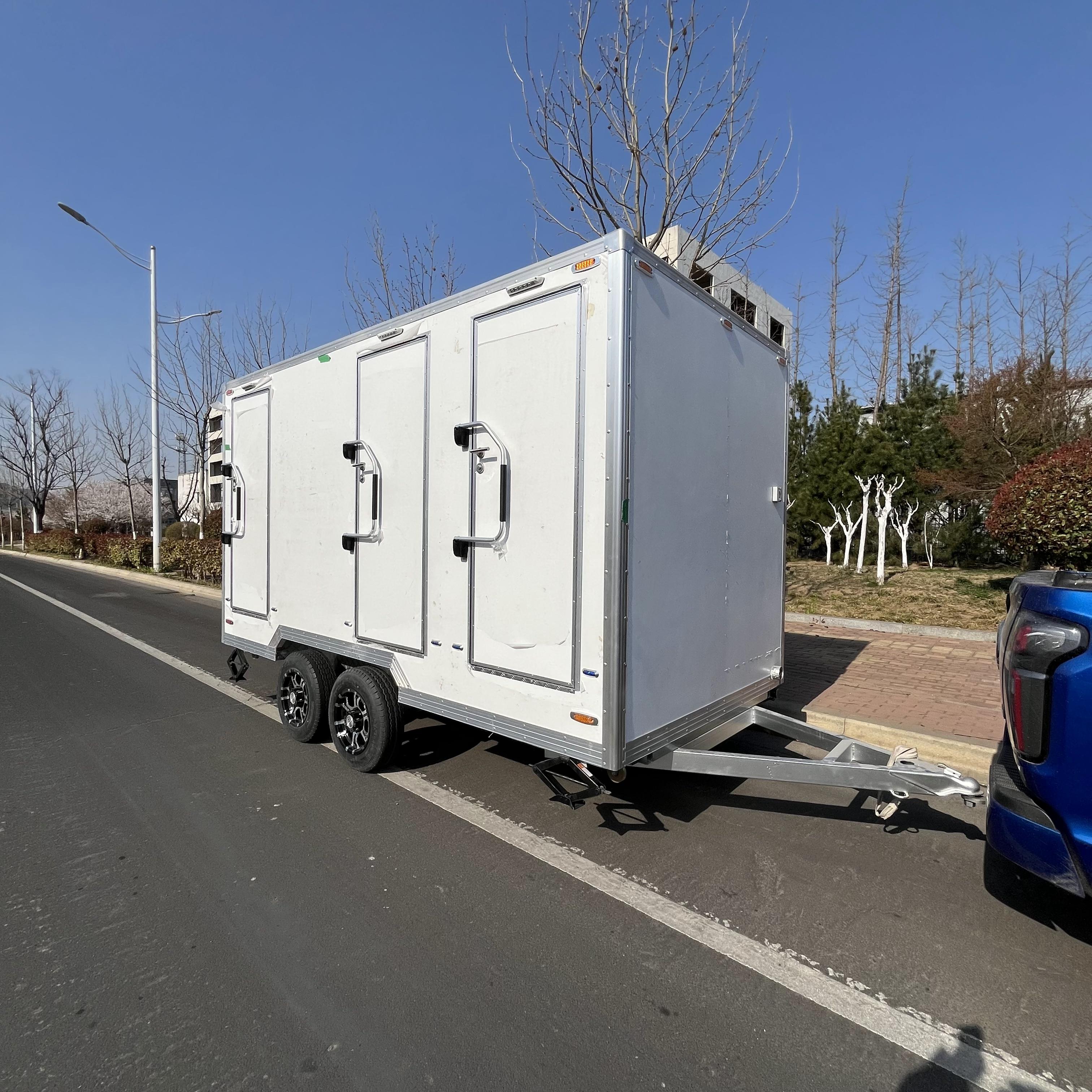 Three white toilet trailers, clean and beautiful mobile toilet Spaces