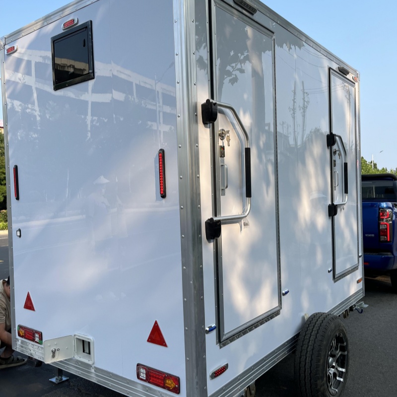 The white trailer double toilet is easy to move and suitable for various scenarios