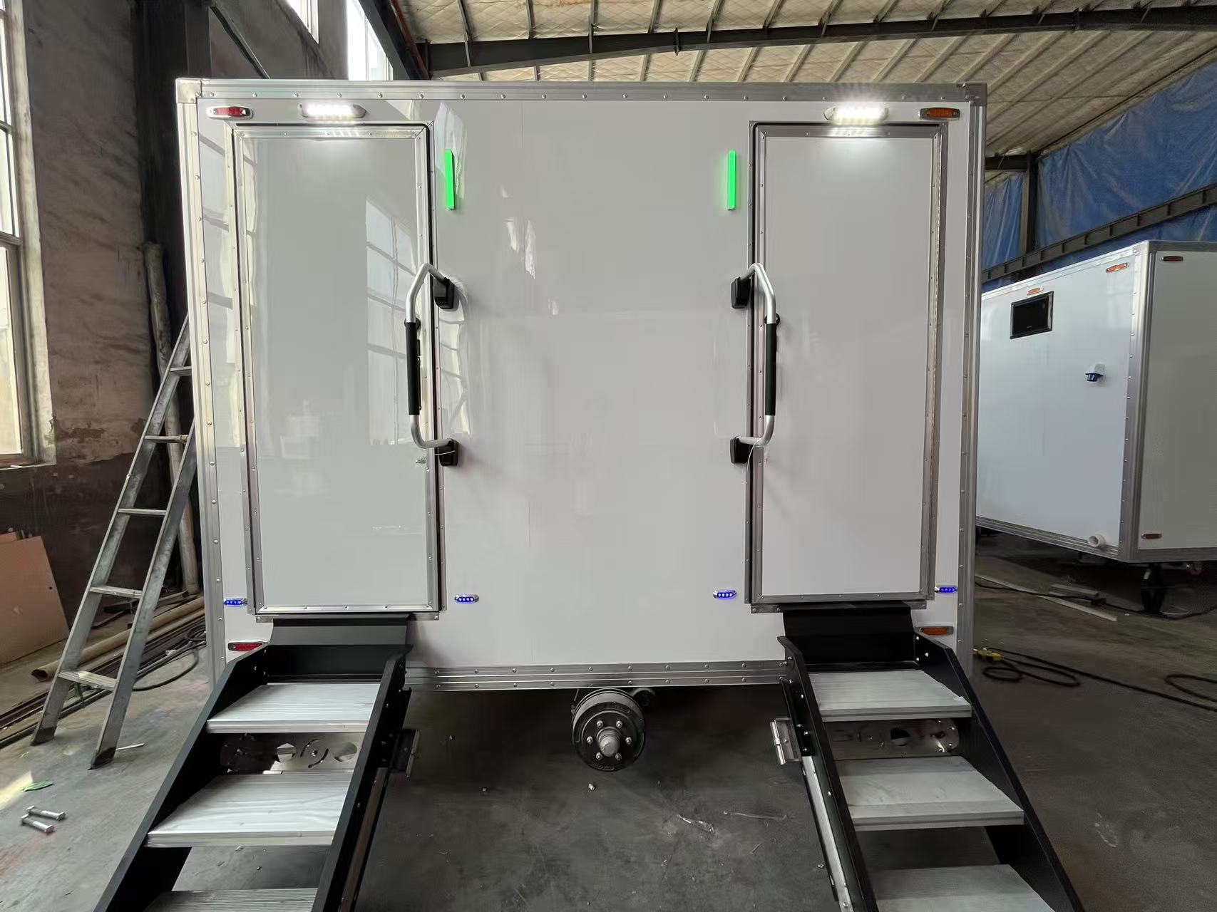 Double-door mobile toilet with lighting to enhance the outdoor usage experience