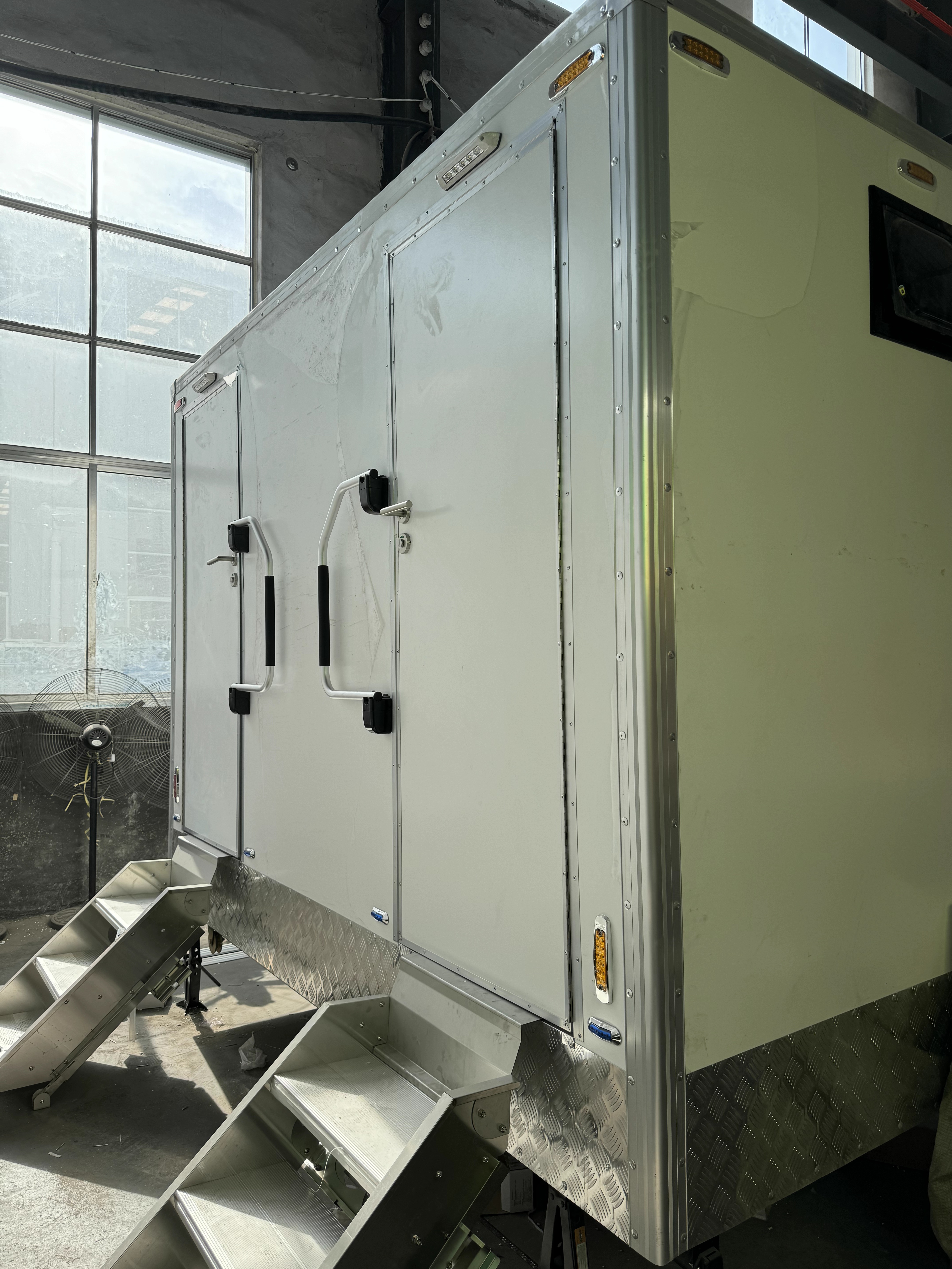 Two-room mobile toilet trailer, ready to move as needed, creates a clean temporary bathroom space