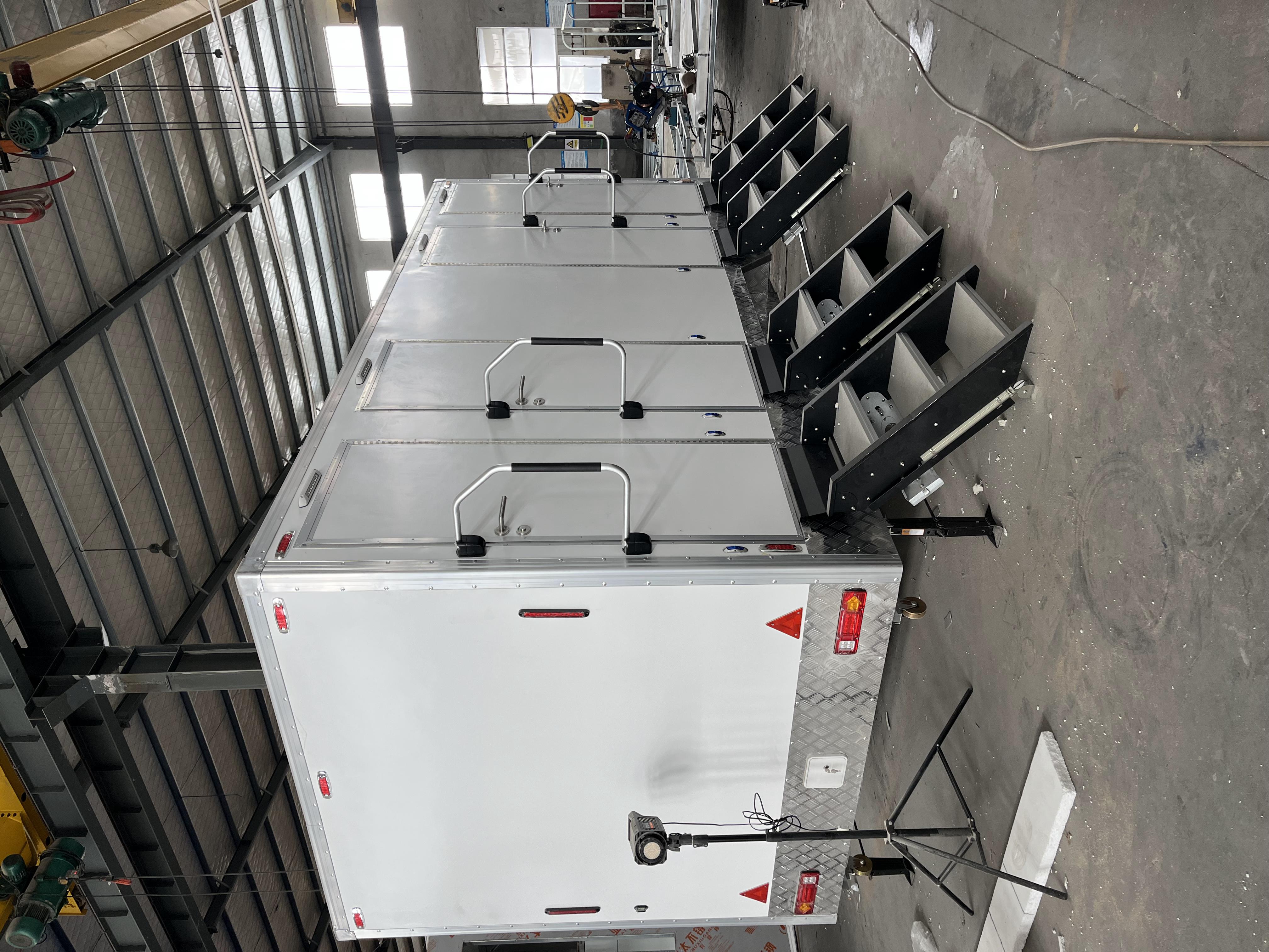 Four outdoor white portable toilets