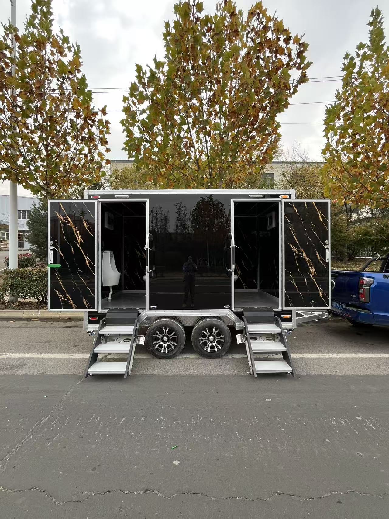 Mobile trailer-type multi-door portable bathroom with black and gold texture outdoor temporary bathroom trailer